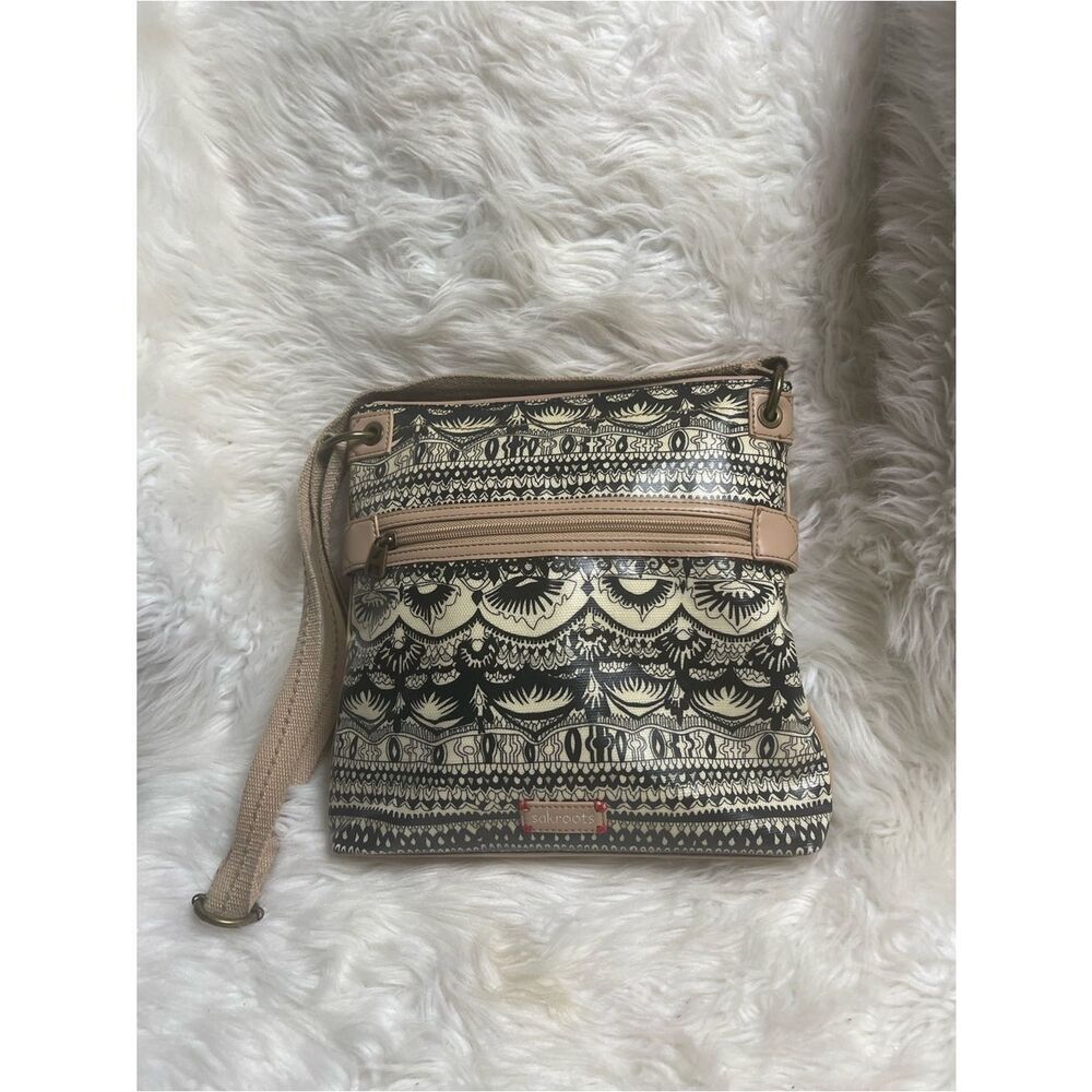 Sakroots Coated Canvas Black & Cream Patterned Crossbody with Tan Trim and trap.